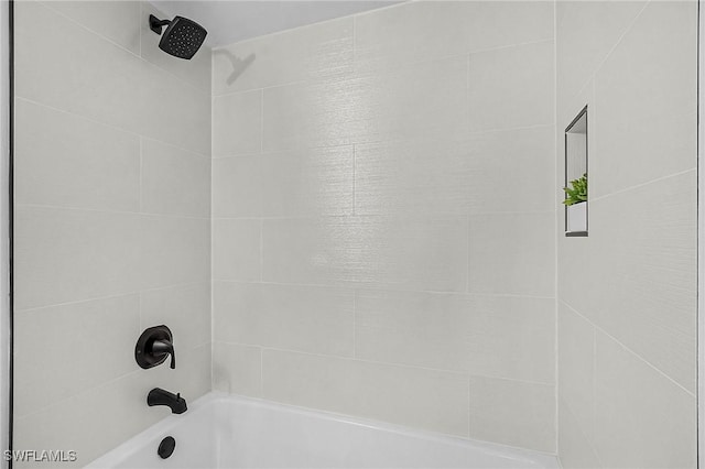 room details featuring shower / bath combination