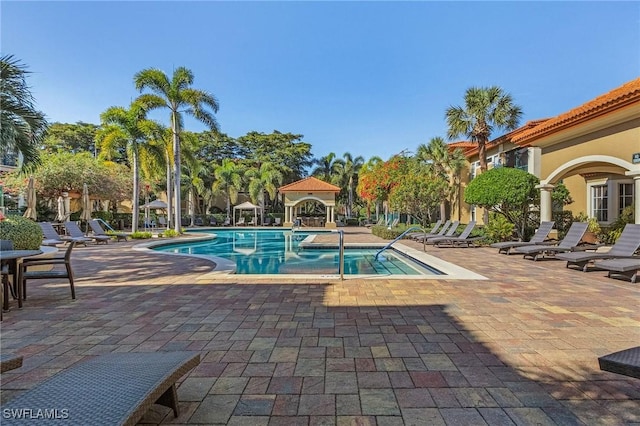 community pool featuring a patio area