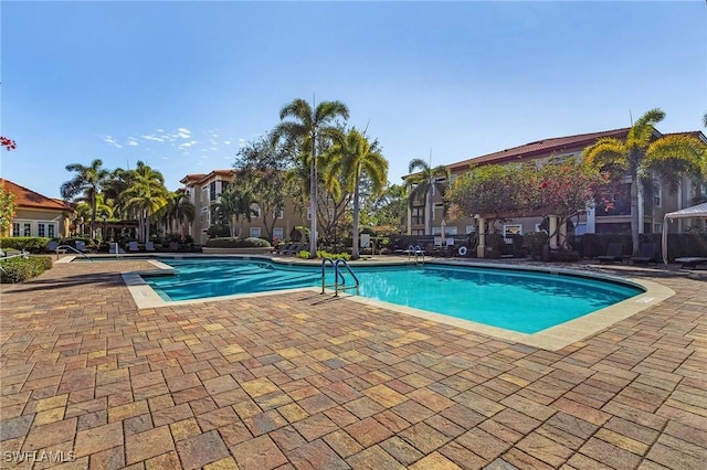 community pool with a patio