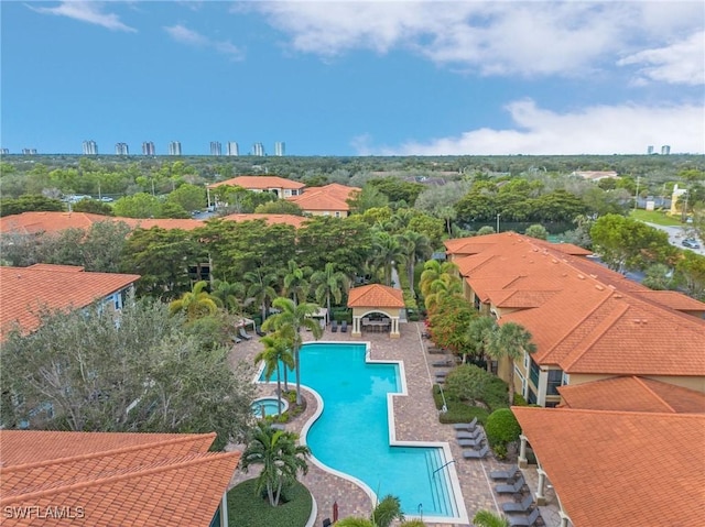 pool with a patio and a gazebo