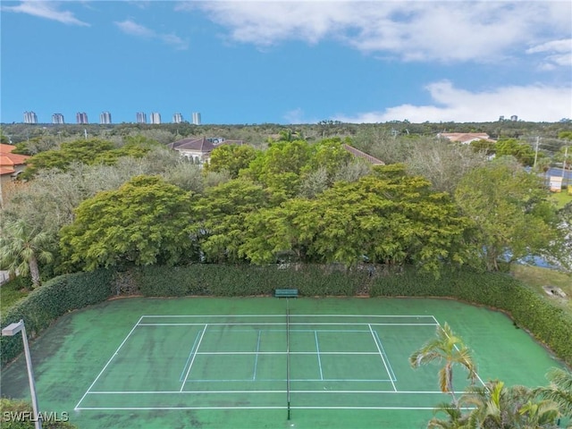 view of sport court featuring fence