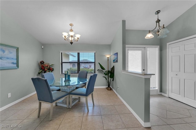 dining area with light tile patterned floors, a healthy amount of sunlight, and an inviting chandelier