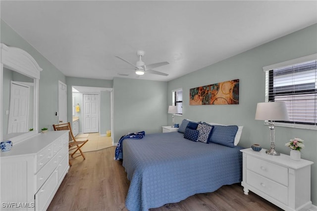 bedroom featuring ceiling fan and hardwood / wood-style flooring