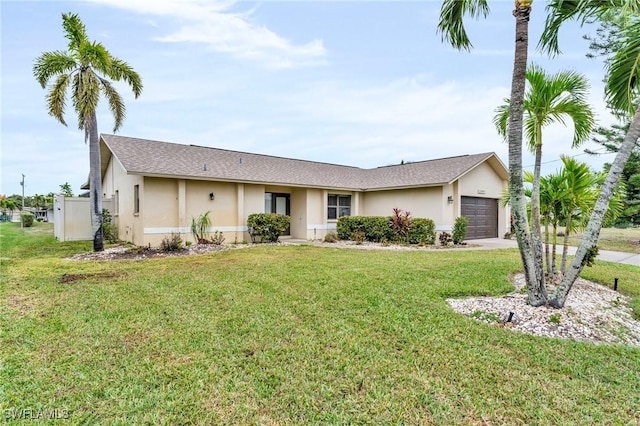 single story home with a front lawn and a garage