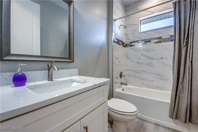 full bathroom featuring toilet, vanity, and shower / bath combo with shower curtain