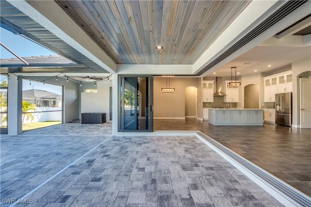 interior space featuring sink and wooden ceiling