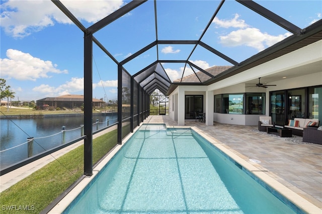 view of swimming pool with a water view, a lanai, ceiling fan, an outdoor living space, and a patio