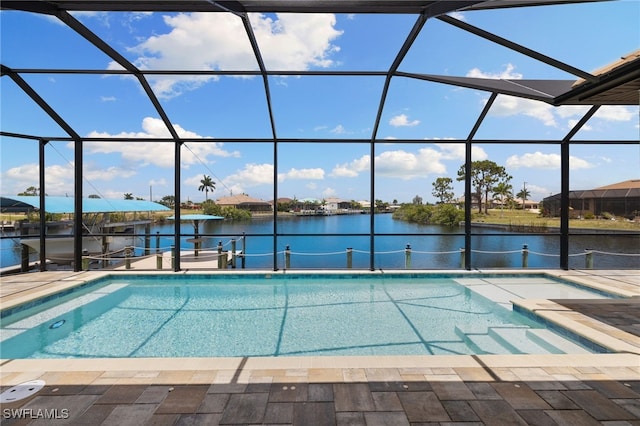 view of pool with a lanai, a dock, a patio, and a water view