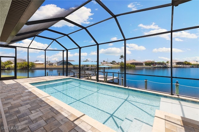 view of pool featuring a lanai, a dock, a patio area, and a water view