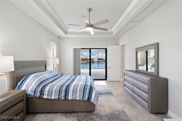 bedroom with light tile patterned floors, access to outside, ceiling fan, and a tray ceiling