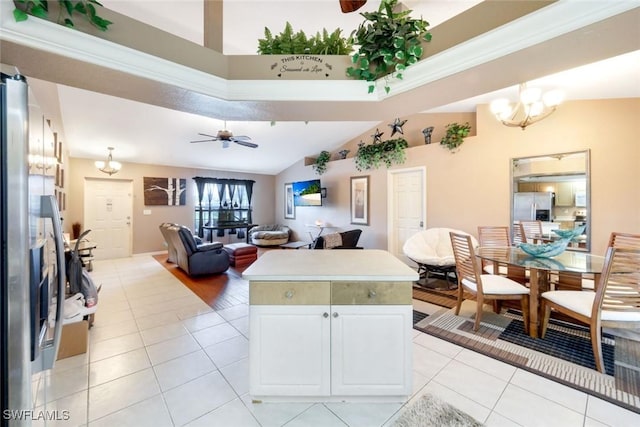 kitchen with light countertops, light tile patterned floors, ceiling fan with notable chandelier, stainless steel refrigerator with ice dispenser, and white cabinets