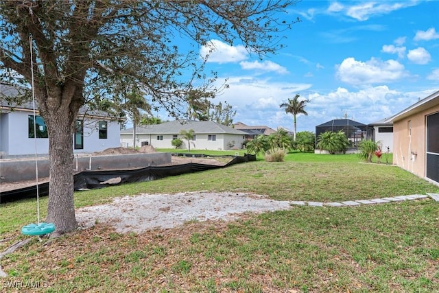 view of yard featuring a residential view and a lanai