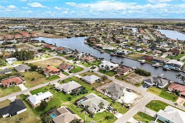 aerial view with a residential view and a water view