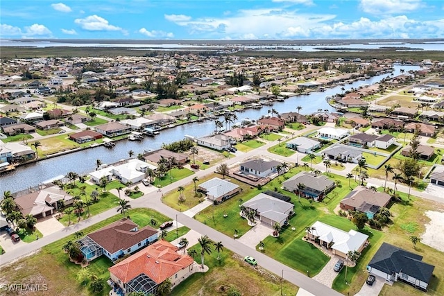 aerial view featuring a residential view and a water view