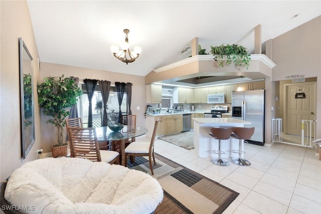 dining space with light tile patterned floors, an inviting chandelier, and vaulted ceiling