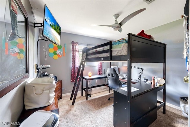 carpeted bedroom with baseboards and a ceiling fan