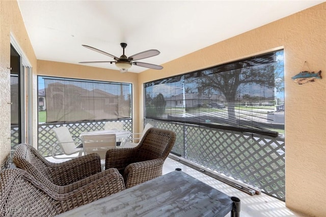 sunroom with a ceiling fan