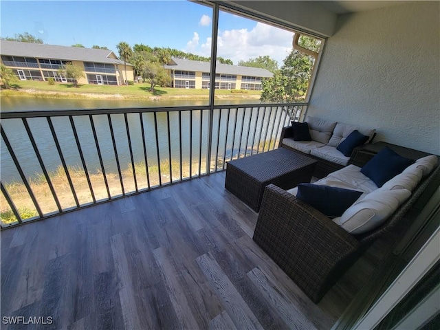 deck featuring an outdoor hangout area and a water view