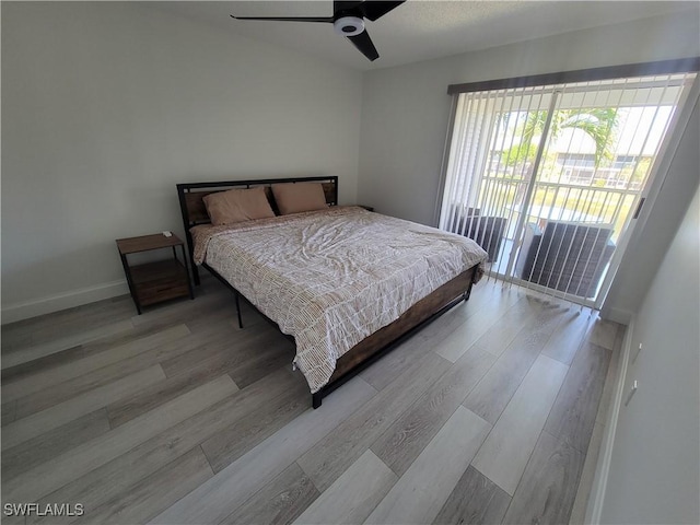 bedroom with ceiling fan, light hardwood / wood-style floors, and access to outside