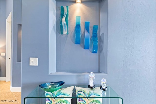 bathroom featuring tile patterned floors and baseboards