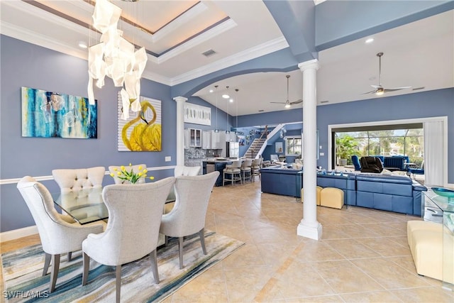 dining space featuring light tile patterned floors, decorative columns, visible vents, ceiling fan, and arched walkways
