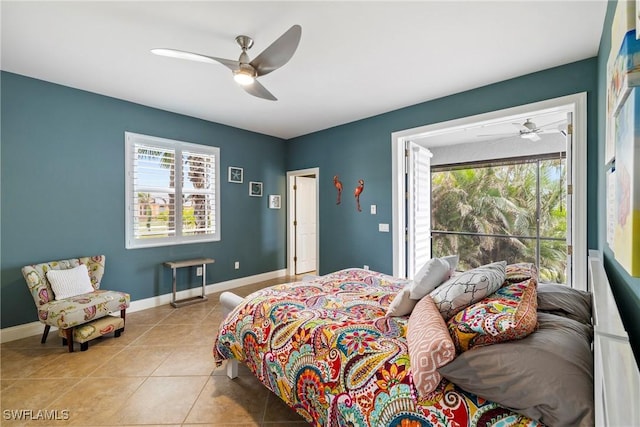 bedroom featuring multiple windows, tile patterned flooring, baseboards, and ceiling fan