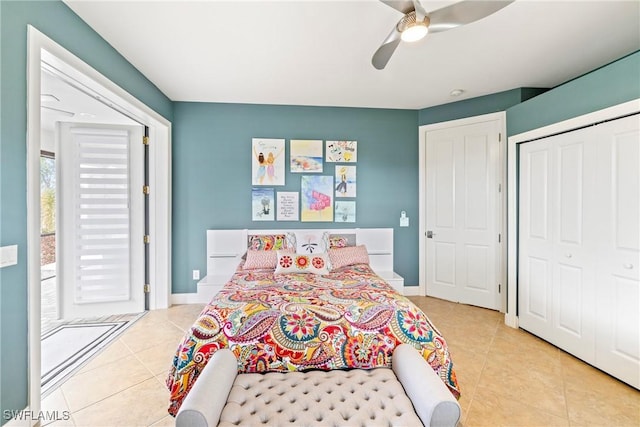 tiled bedroom with a ceiling fan, baseboards, and a closet