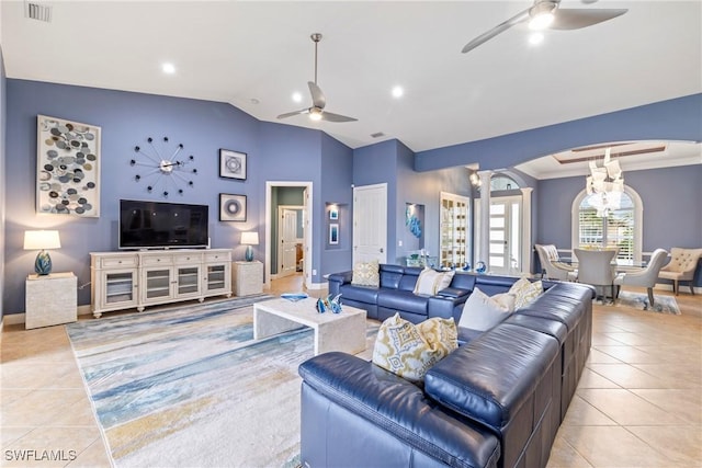 living room with visible vents, a ceiling fan, tile patterned flooring, decorative columns, and vaulted ceiling