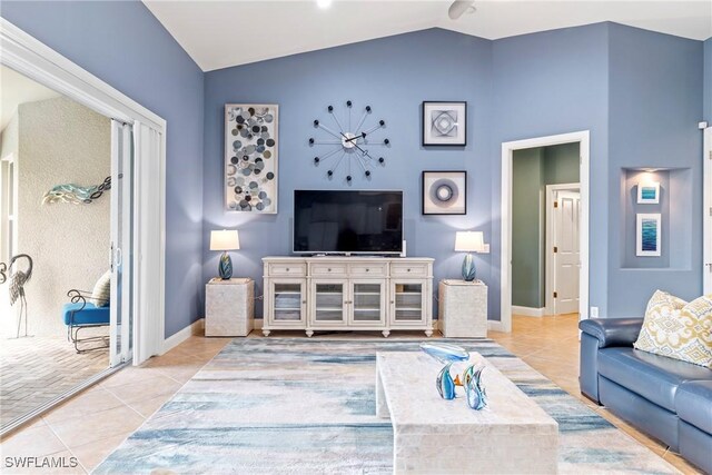 living room featuring light tile patterned floors and lofted ceiling