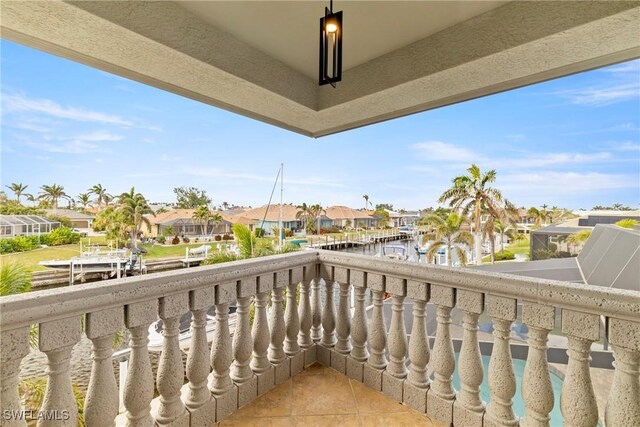 balcony featuring a water view