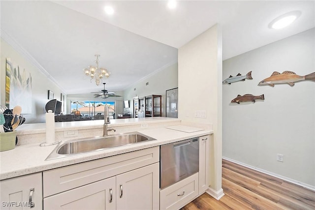 2888 Oleander St Unit C6, Saint James City, FL 33956 - kitchen featuring lofted ceiling, kitchen peninsula, light wood-type flooring, ceiling fan, and stainless steel dishwasher