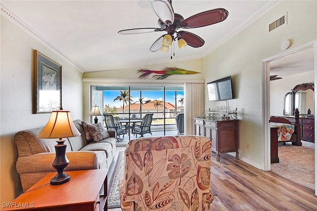 2888 Oleander St Unit C6, Saint James City, FL 33956 - living room featuring light wood-type flooring, ceiling fan, ornamental molding, and lofted ceiling