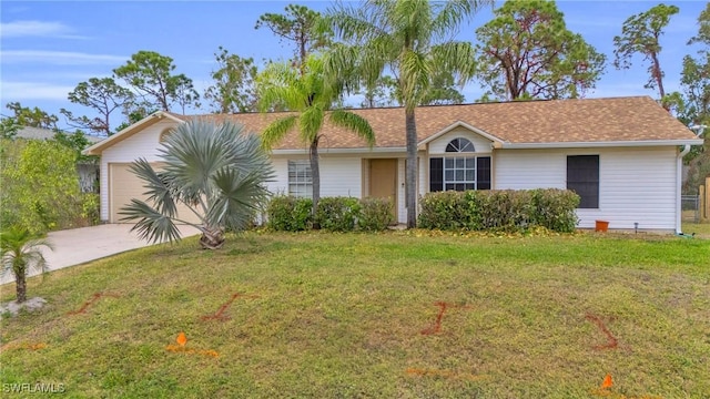 ranch-style home featuring a front lawn and a garage