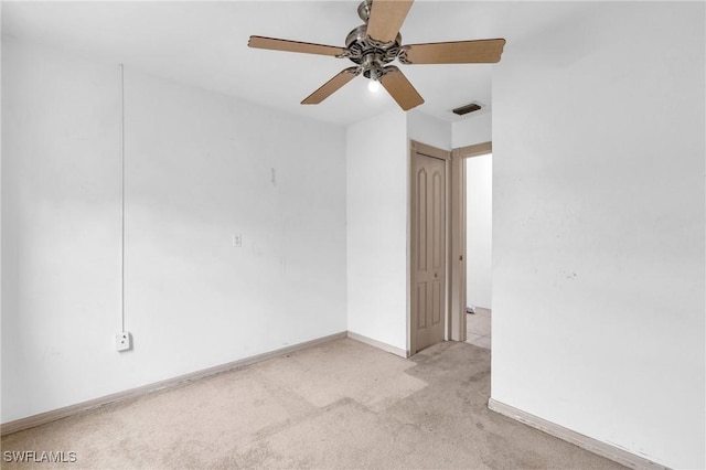 unfurnished room featuring ceiling fan and light colored carpet