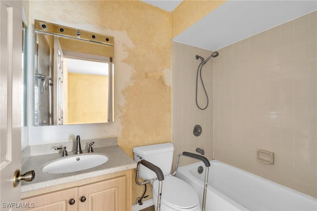 full bathroom with toilet, vanity, and tiled shower / bath