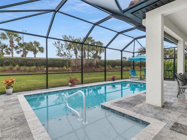 outdoor pool with glass enclosure, a yard, and a patio area