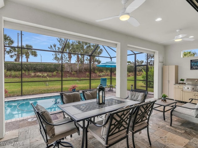 sunroom / solarium featuring outdoor dining space and ceiling fan