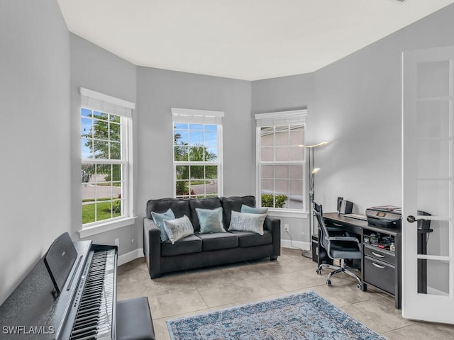 tiled office space featuring baseboards
