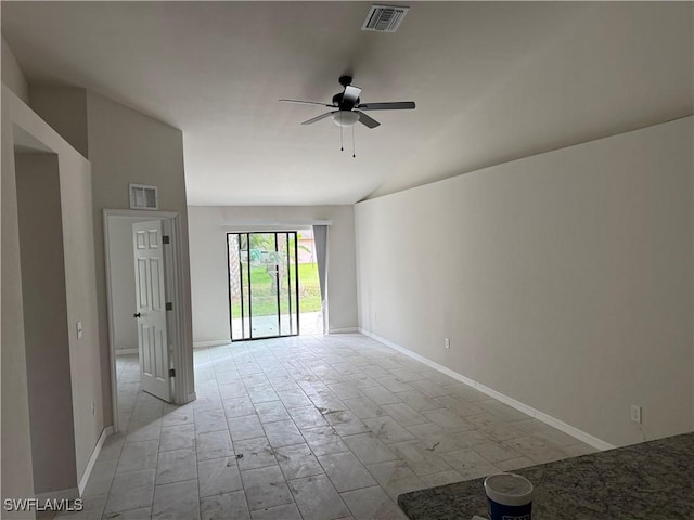 empty room with ceiling fan and lofted ceiling