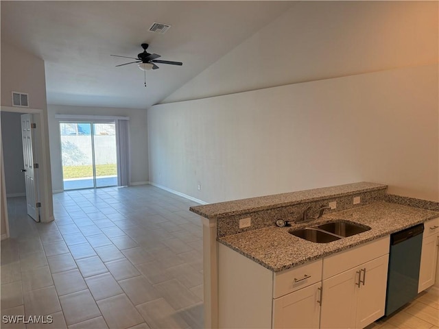 kitchen featuring sink, dishwasher, white cabinetry, light stone countertops, and vaulted ceiling