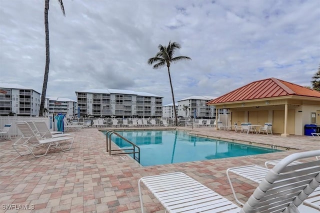 view of swimming pool with a patio