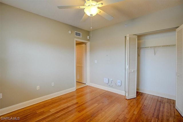 unfurnished bedroom featuring ceiling fan, a closet, and light hardwood / wood-style floors