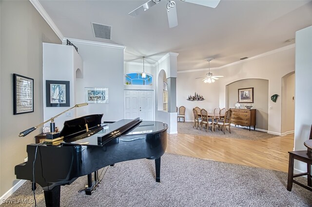 miscellaneous room featuring ceiling fan, ornamental molding, and hardwood / wood-style floors