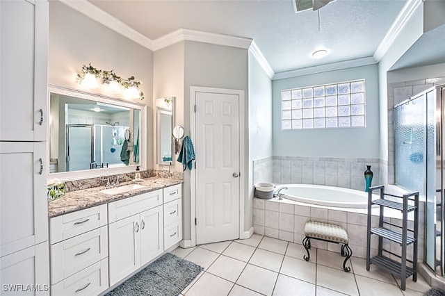 bathroom with a textured ceiling, tile patterned floors, vanity, shower with separate bathtub, and crown molding