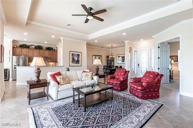 living area featuring recessed lighting, visible vents, and a raised ceiling