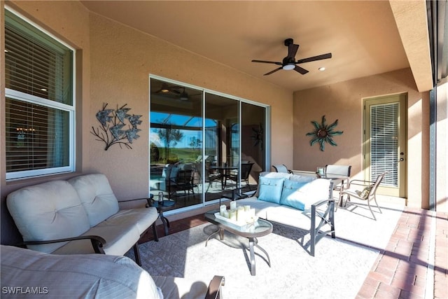 view of patio / terrace with an outdoor living space and ceiling fan