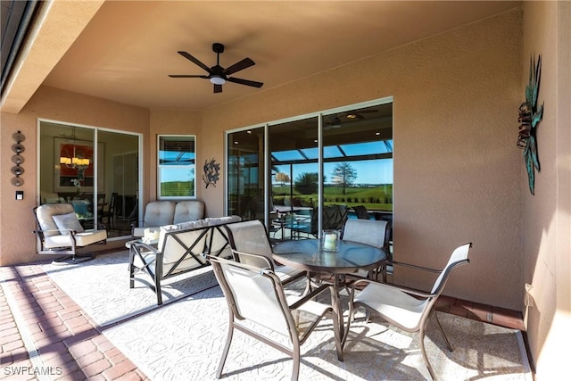 view of patio / terrace featuring ceiling fan