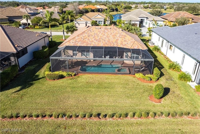 birds eye view of property with a residential view