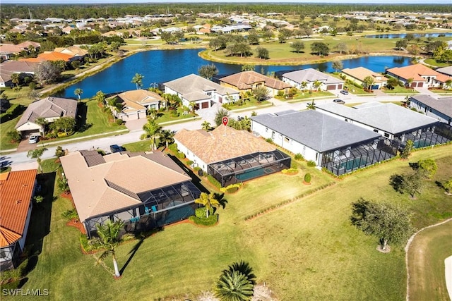 bird's eye view featuring a residential view and a water view