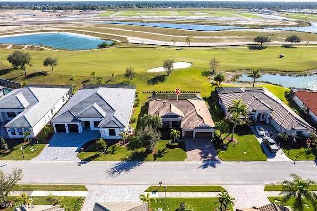 aerial view featuring a residential view, a water view, and golf course view